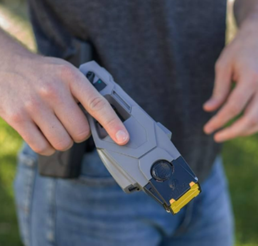 Man holding TASER X1